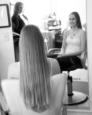 Amanda Mueller grew her hair for four years to donate to Locks of Love. Photo by Diane Davis.